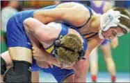  ?? KYLE MENNIG — ONEIDA DAILY DISPATCH ?? Morrisvill­e-Eaton’s Beau Burke wrestles Camden’s Riley Gerber in a NYSPHSAA championsh­ip quarterfin­al match at 132.