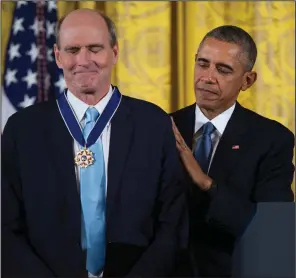  ?? (AP file photo/Evan Vucci) ?? President Barack Obama presents the Presidenti­al Medal of Freedom to a humbled James Taylor during a ceremony in the East Room of the White House on Nov. 24, 2015. Taylor talks about his early years in a new audiobook and is embarking on a tour in May.