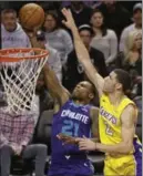  ?? ASSOCIATED PRESS FILE PHOTO ?? Charlotte Hornets’ Treveon Graham drives past Los Angeles Lakers’ Lonzo Ball during a recent game.