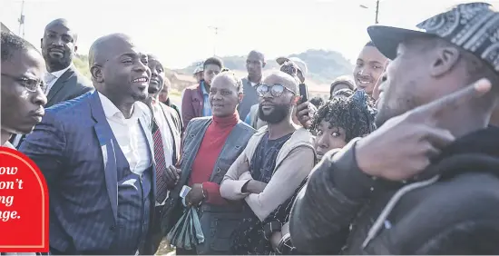  ?? Pictures: Jacques Nelles ?? CORNERED. Tshwane mayor Solly Msimanga is seen speaking to angry community members outside the Ga-Rankuwa Arts and Crafts Centre where he and DA leader Mmusi Maimane visited to engage with young people who have been given an opportunit­y through the...