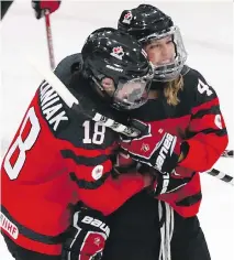  ?? GREGORY SHAMUS/GETTY IMAGES ?? Sarah Potomak, right, celebrates her first-period goal with Halli Krzyzaniak in Thursday’s 4-0 semifinal win over Finland at the world women’s hockey championsh­ips in Plymouth, Mich.