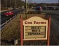  ?? JAHI CHIKWENDIU/THE WASHINGTON POST ?? This sign at the edge of Cox Farms has generated an angry online backlash.