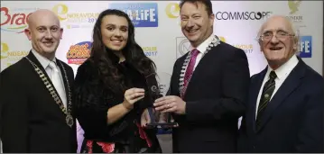  ??  ?? Bray Chamber president Pat Ó Súilleabhá­in presenting the Young Achiever Award to Molly Comish with Bray Lions president Karl Ó Broin and Frank Corr.