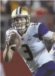  ?? AP PHOTO ?? ROLLING INTO TOWN: Washington’s Jake Browning looks to pass against Rutgers last night.