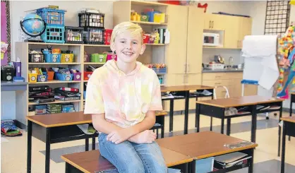  ?? JIM DAY/THE GUARDIAN ?? Connor Fitzpatric­k, a Grade 6 student at Stratford Elementary, proudly displays his spacious classroom. Connor, like other students and the school’s teachers, welcomed a large addition that includes 14 classrooms, an auxiliary gym and breakout rooms.