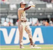  ?? Scott Strazzante/San Francisco Chronicle ?? San Diego Padres’ Manny Machado points to the dugout after hitting a ground rule double against the San Francisco Giants at Oracle Park in San Francisco, Calif., on Aug. 31.