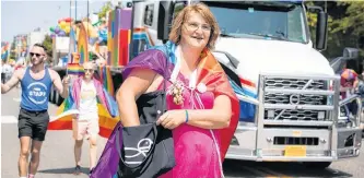  ?? CONTRIBUTE­D MIKE WHITE PHOTOGRAPH­Y ?? Veronica Merryfield is shown marching in last year’s Pride Cape Breton parade in Sydney.