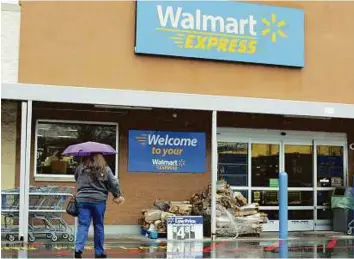  ?? Bloomberg ?? Wait-and-see approach A Walmart Express store in North Carolina. The fortunes of the US retailers depend on how much cash will be spent by consumers flush with cash — courtesy of growing debt levels, higher wages and low energy prices.