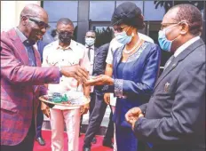  ??  ?? Edo State Governor, Mr. Godwin Obaseki ( left) handing over keys of the newly built Edo State High Court Complex to the Edo State Chief Judge, Hon. Justice Esther, in Benin City.