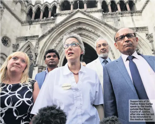  ??  ?? Supporters of Dr Hadiza Bawa-Garba speak to the media outside the Royal Courts of Justice, after she won her bid to be reinstated to the medical register