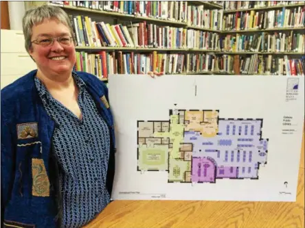  ?? SARATOGIAN FILE PHOTO ?? Galway Public Library Manager Deb Flint shows the floor plan of the proposed $2.6 million library that’s scheduled to open in 2019.