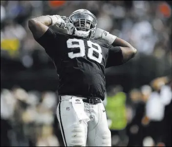  ?? D. Ross Cameron The Associated Press ?? Raiders defensive tackle Frostee Rucker howls to the heavens in the second half of a 45-42 overtime victory against the Cleveland Browns on Sept. 30 in Oakland, Calif. The 13-year NFL veteran could be playing the final game of his career on Sunday when the Raiders conclude their 2018 season with a game at the Kansas City Chiefs.