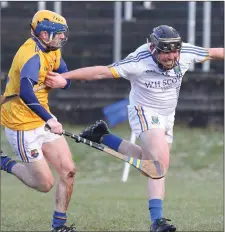  ??  ?? Wicklow’s George O’Brien is hauled back by Aidan Sheridan.