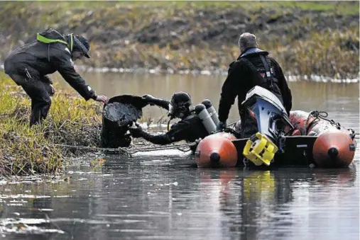  ??  ?? IN DEPTH INQUIRY: Police Scotland divers search the Monklands Canal for the remains of 11-year-old schoolgirl Moira Anderson yesterday