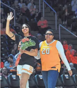  ?? ANGELINA ALCANTAR/KNOXVILLE NEWS SENTINEL ?? Tennessee center Tamari Key walks with her mom, Tammy Brown, during the senior night celebratio­n before the Feb. 29 game against Texas A&M at Thompson-Boling Arena at Food City Center in Knoxville. The Lady Vols won 75-66.