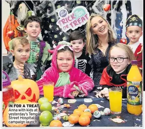  ??  ?? IN FOR A TREAT Anna with kids at yesterday’s Temple Street Hospital campaign launch