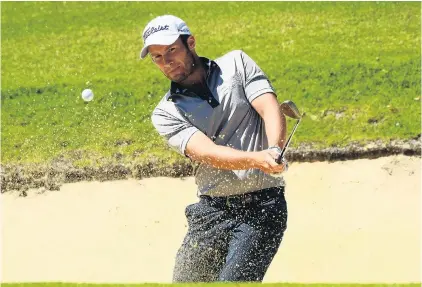  ?? PHOTO: GETTY IMAGES ?? Be gentle, Ben . . . New Zealander Ben Campbell plays out of the bunker during the fourth round of the Fiji Internatio­nal in Natadola yesterday. Campbell shot a 6under 66 to finish in a tie for third on 12under, two strokes behind winner Gaganjeet...