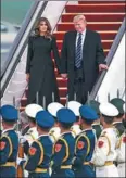  ?? XU JINGXING / CHINA DAILY ?? US President Donald Trump and his wife, Melania, arrive on Air Force One at Beijing Capital Internatio­nal Airport on Wednesday, starting a three-day state visit to China.