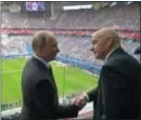  ?? ALEXEI DRUZHININ — SPUTNIK, KREMLIN POOL PHOTO VIA AP ?? Russian President Vladimir Putin, left, and FIFA President Gianni Infantino shake hands before the Confederat­ions Cup match between Russia and New Zealand in St. Petersburg, Russia, on Saturday.