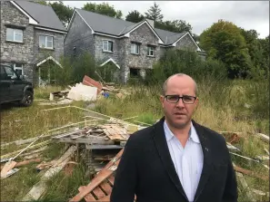  ??  ?? Councillor Chris MacManus at an empty estate on the Keash Road in Ballymote.