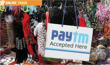  ?? — Reuters ?? An advertisem­ent of Paytm, a digital wallet company, is pictured at a road side stall in Kolkata, India.