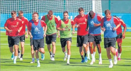  ?? REUTERS ?? Belgium's Eden Hazard with teammates during training on Wednesday. Hazard and teammate Kevin De Bruyne will miss the opening game against Russia.