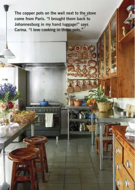  ??  ?? The copper pots on the wall next to the stove come from Paris. “I brought them back to Johannesbu­rg in my hand luggage!” says Carina. “I love cooking in those pots.”