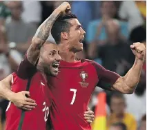  ?? AFP/GETTY IMAGES ?? Portugal’s Ricardo Quaresma, left, and Cristiano Ronaldo celebrate defeating Poland on Thursday in a Euro 2016 quarter-final.