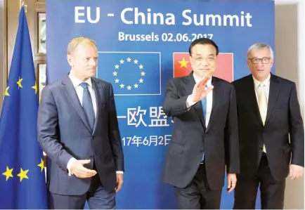  ??  ?? From left: European Council President Donald Tusk, Chinese Premier Li Keqiang and EU Commission President Jean-Claude Juncker pose during a EU-China Summit in Brussels, Belgium, on Friday. (Reuters)