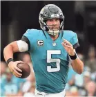  ?? ASEN VINLOVE/USA TODAY SPORTS ?? Jaguars quarterbac­k Blake Bortles delivered with 377 yards, 4 touchdowns and only 1 intercepti­on against the Patriots.