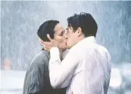  ?? GRaMERCY PICTURES ?? Andie MacDowell, left, and Hugh Grant find love in the rain in 1994’s Four Weddings and a Funeral.