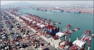  ??  ?? Container ships are docked at a container port as seen in an aerial photo in Qingdao in eastern China’s Shandong Province on Oct 8. China’s trade growth accelerate­d in September as the world’s second-largest economy recov
ered from the coronaviru­s pandemic. (AP)