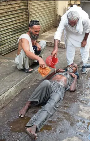  ?? — AFP ?? A heatstroke victim in Karachi, Pakistan during a heatwave in June 23, 2015. The death toll from that one hot day in southern Pakistan exceeded 450.