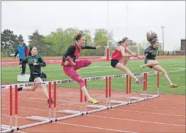  ?? JENNIFER VARDY LITTLE ?? Competing in the senior girls’ hurdles were, from left, Chihami Kobayashi, Central Kings; Julia Schmidtt from King’s-Edgehill School; Brittney MarkeyPeac­h from West Kings; and Danielle Hayden from Central Kings.