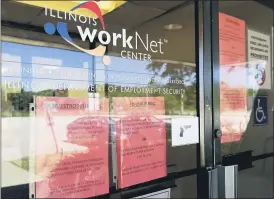  ?? NAM Y. HUH — THE ASSOCIATED PRESS ?? Informatio­n signs are displayed at the closed Illinois Department of Employment Security WorkNet center earlier this summer in Arlington Heights, Ill. U.S. businesses sharply reduced hiring in a sign that the resurgent viral outbreak this summer slowed the economic recovery as many states closed parts of their economies again and consumers remained cautious about spending.
