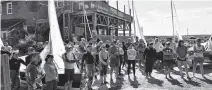  ??  ?? Competitor­s attend the first pre-race briefing for the 2019 Internatio­nal Albacore Championsh­ip regatta being hosted by the Shelburne Harbour Yacht Club.