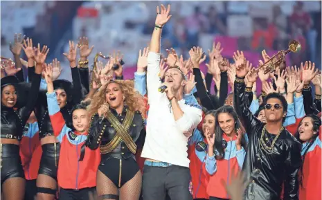  ?? ROBERT DEUTSCH, USA TODAY SPORTS ?? Beyoncé, Chris Martin and Bruno Mars pull the whole gang together to wrap up the Super Bowl halftime show Sunday night.