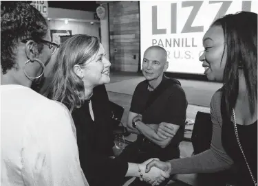  ?? Brett Coomer / Staff photograph­er ?? Democrat Lizzie Pannill Fletcher, second from left, greets supporters as they celebrate her win over Rep. John Culberson on Nov. 6. The incoming lawmaker is seeking elusive common ground as she heads to Washington.