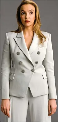  ??  ?? Cream Balmain suit: jacket, €1,490, and trousers, €1,340 BALMAIN