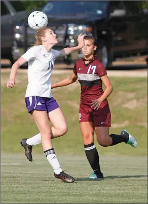  ?? Terrance Armstard/News-Times ?? Balancing act: El Dorado's Carson Henry tries to control the ball against Benton's Abby Walker. The Lady Panthers upended the Lady Wildcats 5-1 Tuesday at the El Dorado Soccer Complex.