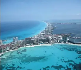  ?? ISRAEL LEAL, AP ?? Cancún’s white-sand beaches and party atmosphere attract multitudes of tourists and tourist dollars to Mexico to the tune of $20 billion a year.