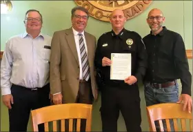  ?? PHOTO BY MARILEE JOHNSON ?? Deputy A.J. Mcguffin is presented a Letter of Commendati­on by Logan County Commission­ers. From left are Mike Brownell, Jerry Sonnenberg, Mcguffin, and Joe Mcbride.