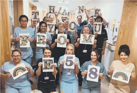  ??  ?? Staff on Sunderland Royal’s Ward E58 and, below, Tyne and Wear Fire & Rescue crews thank the group for their support.