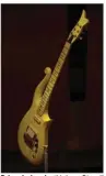  ?? (For The Washington Post/Astrid Riecken) ?? Prince’s iconic “Yellow Cloud” guitar, which was painted white for the film “Purple Rain,” was donated by the artist in 1993.