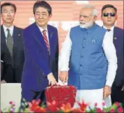  ?? REUTERS ?? PM Narendra Modi and his Japanese counterpar­t Shinzo Abe press a button to signify the launch of the bullet train project.
