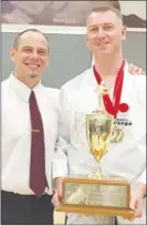  ?? Photo contribute­d ?? Sensei Don Sharp, president of JKA Canada and 1996 world karate champion, left, awards Sensei Paul Atkin of Kelowna Karate & Fitness Inc. the elusive Sakurai Shihan Award on top of his two gold medals at the provincial­s in Chilliwack.