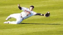  ?? DYLAN SLAGLE/CARROLL COUNTY TIMES ?? Outfielder Ryan Mountcastl­e dives for the ball but misses it during the sixth inning of the Baltimore Orioles’ home opener at Oriole Park at Camden Yards April 8.