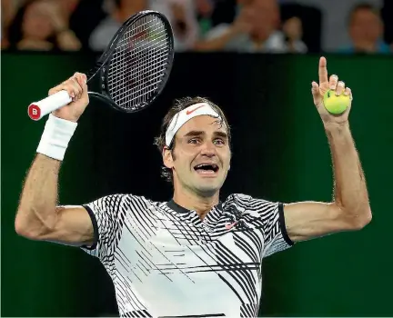  ?? CAMERON SPENCER/ GETTY IMAGES ?? Roger Federer celebrates victory in Melbourne, winning the Australian Open for his 18th grand slam title.