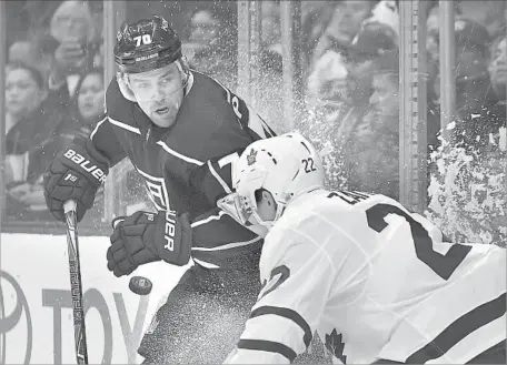  ?? Mark J. Terrill Associated Press ?? THE PUCK is in the air, and the Kings’ Tanner Pearson and Toronto’s Nikita Zaitsev want it during the second period at Staples Center.