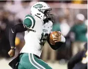  ?? ANDREW ULOZA FOR THE MIAMI HERALD ?? Miami Central quarterbac­k Keyone Jenkins led a second-half comeback in a win against Heritage on Friday.